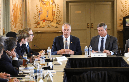 Lawmakers gathered around meeting table