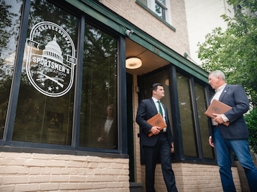 Two politicians outside Congressional Sportsmen's Foundation office