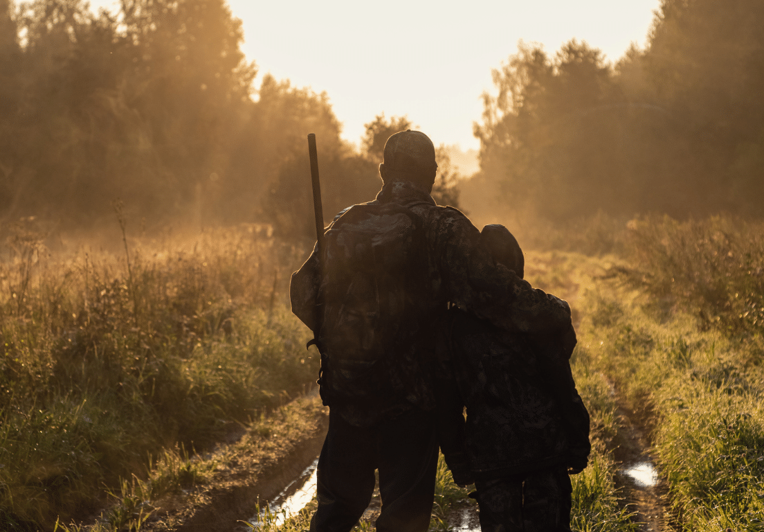 Hunter with arm around his son's shoulder