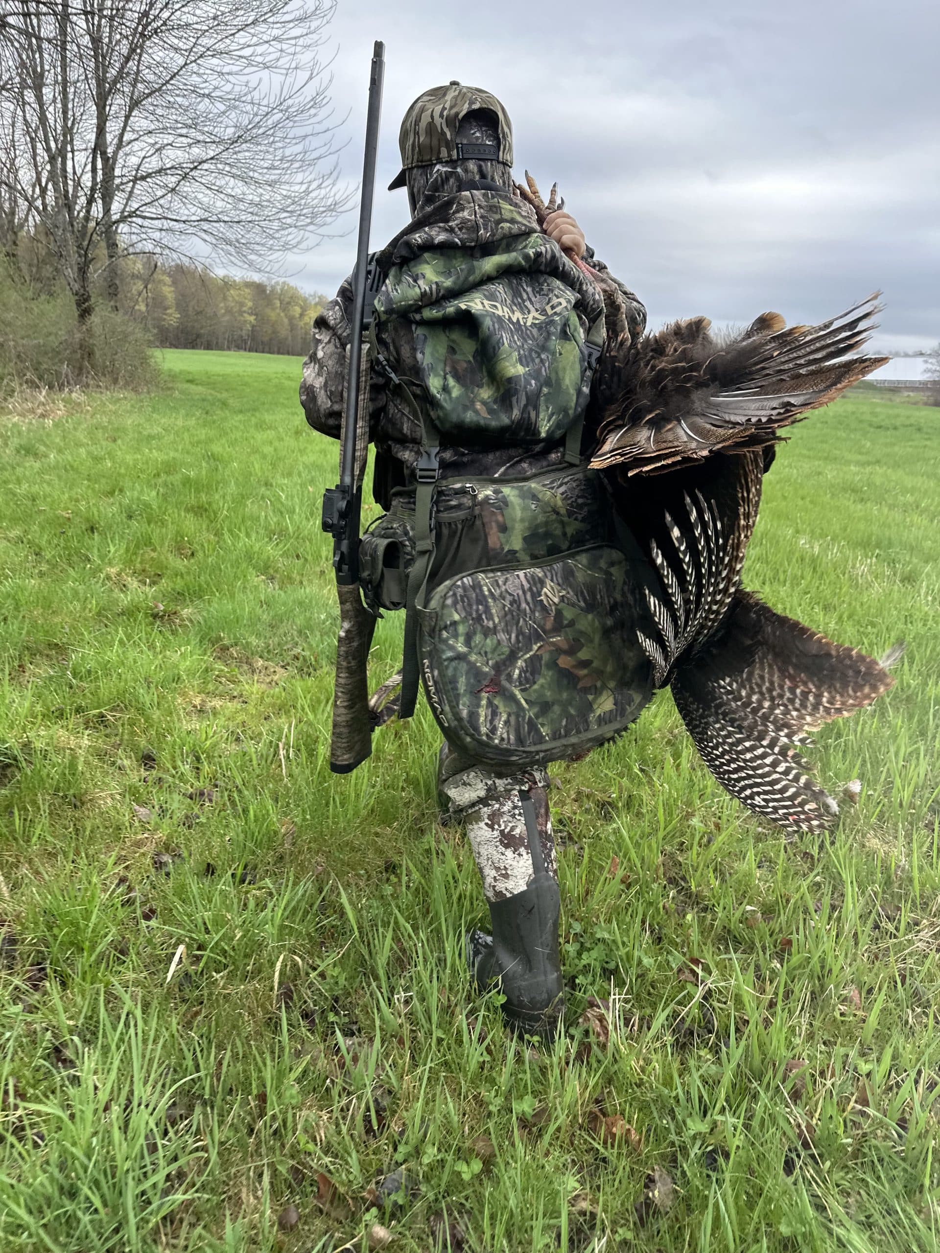 Hunter carrying turkey